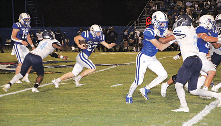 In a familiar sight, St. Edmund running back Henry Summerlin carries the ball for yardage this time against Westminster Christian on Thursday. (Photo by Rhett Manuel)