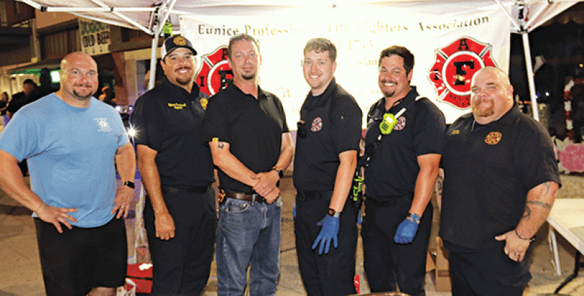 The Eunice firefighters were seen at Eunice’s Fall Back Downtown event Thursday evening. The union held a burgers fund raiser during the event. From left, are Christian Walker, operator; Manny Sandoval, captain; Fire Chief Chaise Brown, Blake Smith, operator; Ben Brown, operator; and Jeremy Faulkner, captain. (Photo by Harlan Kirgan.