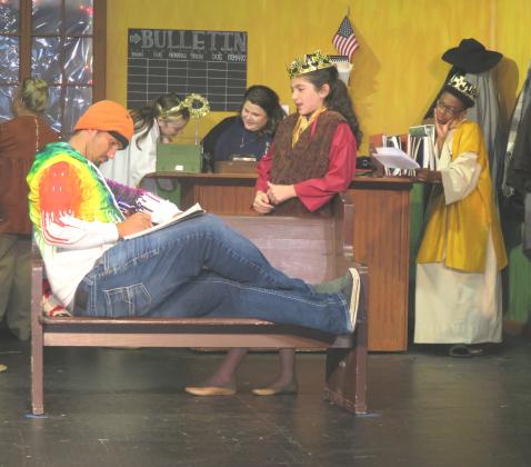 In this photo, stranded train passengers visit with children who have arrived to perform the Nativity play for them.  From left, are Denise Fusilier, Jace Hebert, Liana Reed, Allison Reed, Madeline Pitre and Makedein Guidry. (Submitted photo)