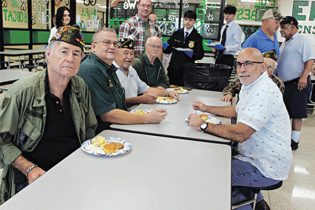 Eating breakfast are veterans Terry W. Fontenot, Donnie Fontenot, Robert Witkovski, Leelen Lavergne, Paul Ganucheau, Harry Reed and Chris Fontenot.