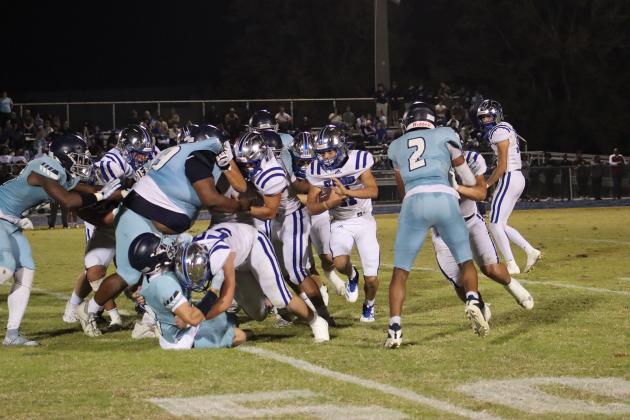St. Ed’s Blue Jay running back Cooper Berzas carries the ball for yardage against Westminster last Friday evening. (Photo by Amy Myers)