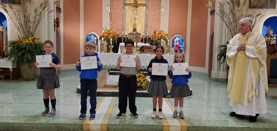 From left, are Audrey Comeaux, second grader; Colin Duplechin, fourth grader; Cooper Ardoin, fifth grader; Ally Ward, third grader; Mary Grace Mire,  first grader; and the Rev. Hampton Davis. (Submitted photos)