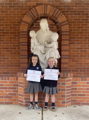 Young Christians were honored at St. Edmund. From left, are Ayda Fuselier, kindergartener; and Molly Kate Brown, pre-k.