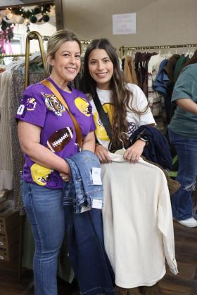 Mother-daughter shopping duo are at Noel on the Prairie Saturday. From left, are Kindsey and Rhylee Ardoin waiting to try on outfits at Vogue la Vie.