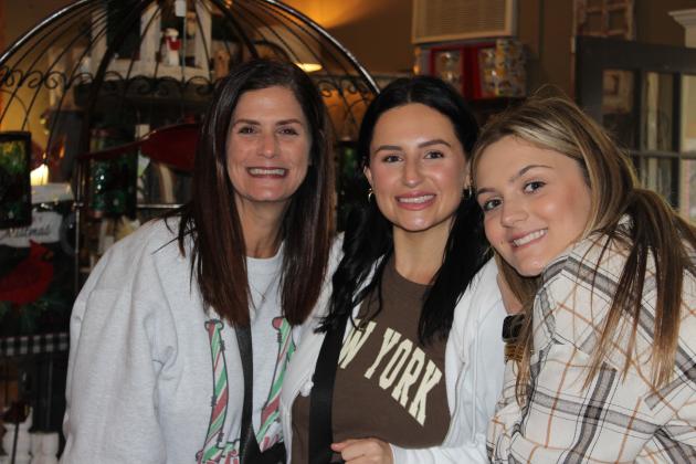 Shopping at The Iron Gate are Liz Arnaud, left, Lindsay Landry and checking out customers, at right,  is Hallie Arnaud.