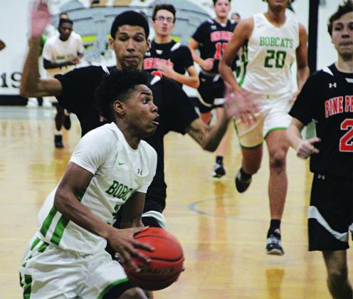 Sophomore Dee Johnson led the Bobcat scoring with a 19 points against Pine Prairie. (Photos by Rhett Manuel)