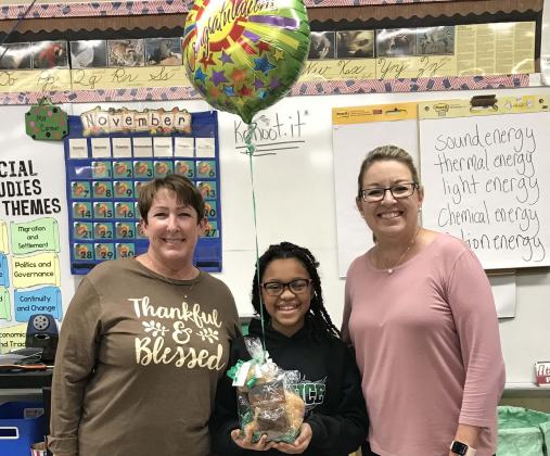 East Elementary announces its Student of the Year. Kinsley Johnson, a fourth grader. Johnson was awarded the distinguished honor. Her teacher is Vanessa Cormier, at left. Johnson is known to be an excellent student and a role model for others. Gina LaGrange, right, is her principal.