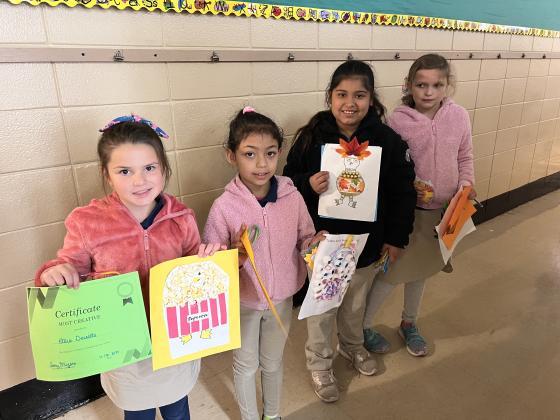 Disguised second grade turkey winners at East are from left Ellie Deville, Malaina Martinez, Jiselle Castillo and Kallie Bond.