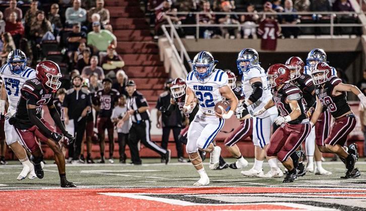 Blue Jay senior Wyatt Dubois delivered one of the finest postseason performances in school history, battering the Lions for 231 rushing yards and five touchdowns on 15 carries. (Photo by Dwight Jodon)