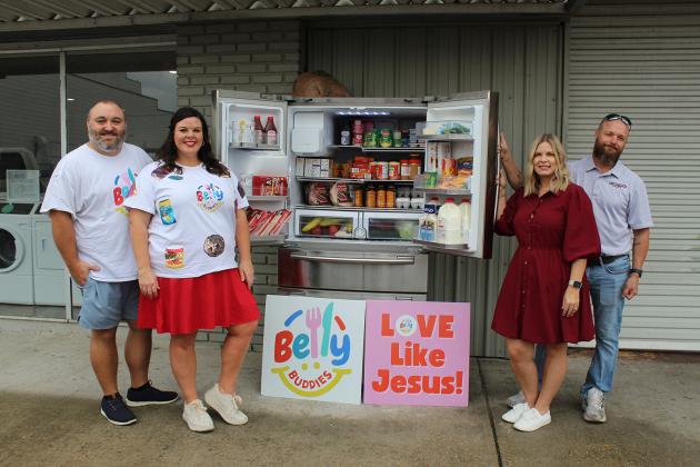 Belly Buddies Community Fridge is now opened. From left are Brad Richard, Katie Richard, Allie Soileau and Stormy Soileau.