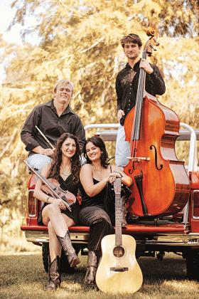 The Cajun band Amis Du Teche includes Laykin Usie, Adeline Miller, Amelia Powell and Robert Miller. (Photo by Emily Schneider/EmilyRainePhoto. Courtesy of Adeline Miller) 