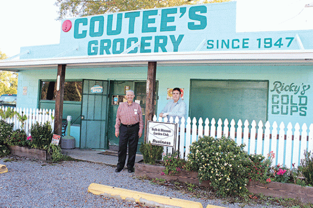 Coutee’s Grocery received the Bulb &amp; Blossom Garden Club Business of the Month in December 2022. Joe Coutee Jr. and Ricky Coutee are pictured. (Photo by Myra Miller)