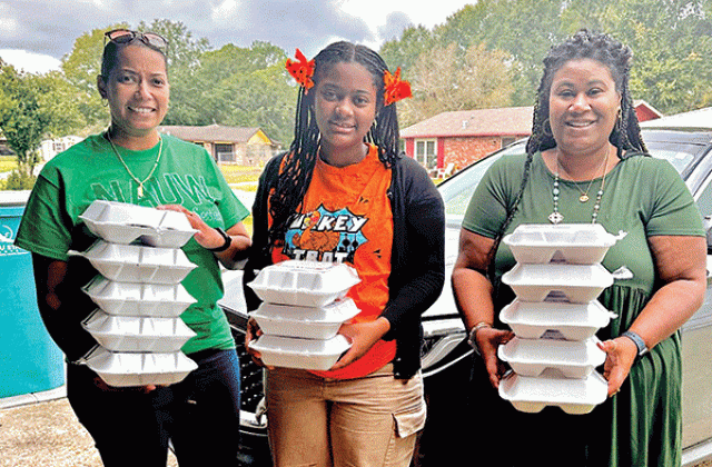 Thanksgiving dinners were delivered to special people by NAUW Eunice Branch. Dinners were prepared for the organization by Rosaline Allison Williams and delivered by LaJuana J. Ray, left, NAUW member; Jordan K. Ray, and Shelsy Williams, branch president of NAUW. Not pictured is Keveius Givs Jr. Givs delivered dinners. (Submitted photo)