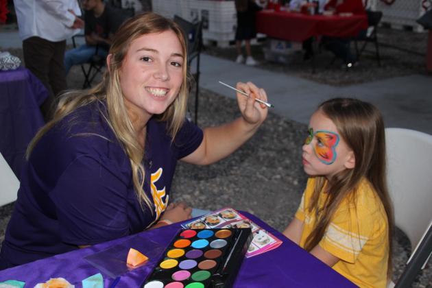 Face painting at Community Garden Christmas Festival