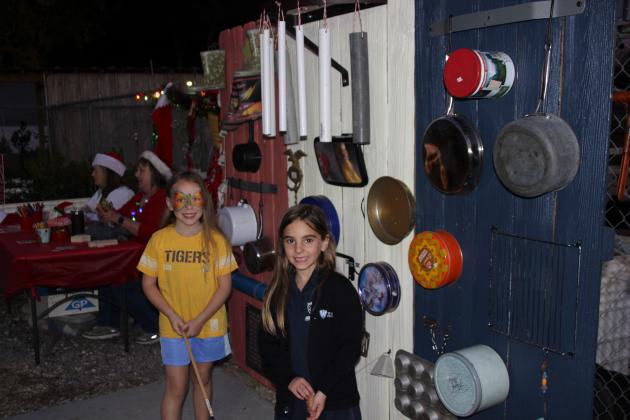 Ellie Lyons and Nikita Soileau at a Sensory board
