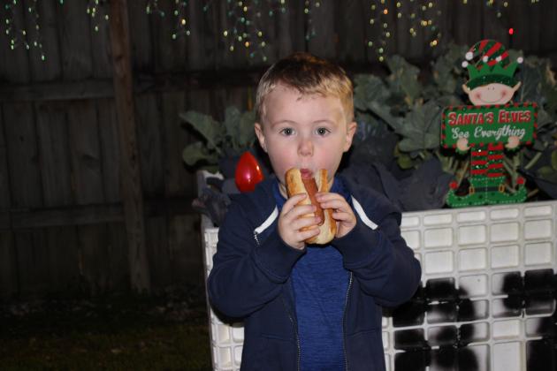 Reid Richard enjoys a hot dog