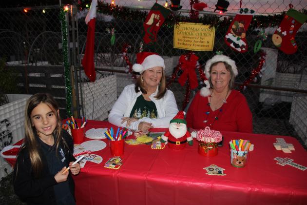 Nikita Soileau at a craft table sponsored by St. Thomas More Catholic Church