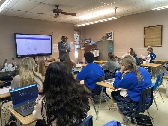 Floyd Collin Henry, ASVAB career exploration program manager, assisted St. Edmund students with interpreting their vocational aptitude battery results.