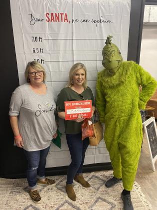 Shannon White and Aimee Fontenot visit with The Grinch