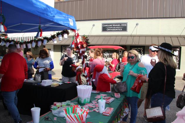 People gathered at Nick's on 2nd booth