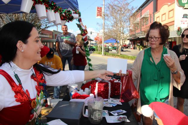 Ashley Dubroc hands out to Kim Smith at Nick's