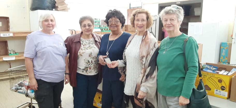 Bulb &amp; Blossom Garden Club donates check to Eunice Food Bank.