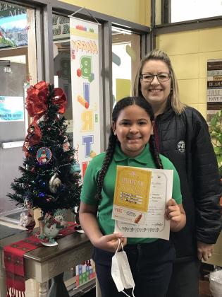 Anastyn Reed was recently honored as a Positive Office Referral student at East Elementary. She is with her principal Gina LaGrange.