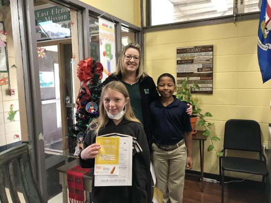 Avah Blount, left, and Isaiah Guillory, students at East Elementary, were honored as Positive Office Referrals. They are pictured with Principal Gina LaGrange.