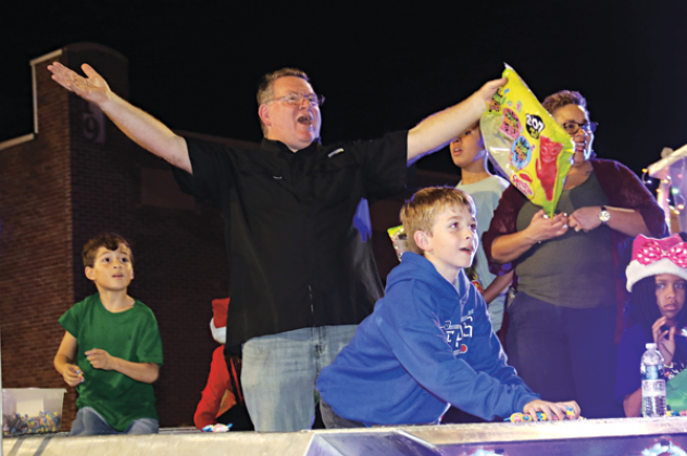 Eddie Thibodeaux appeared to be having fun as he rode on a float from the St. Landry Parish Sheriff’s Office at Thursday’s Christmas Parade of Lights parade in Eunice. Thibodeaux is deputy chief with the Sheriff’s Office. (Photo by Harlan Kirgan)
