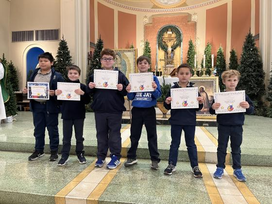 St. Edmund students were recognized after an All-School Mass for completing their first quest in the Boost Reading Intervention Program