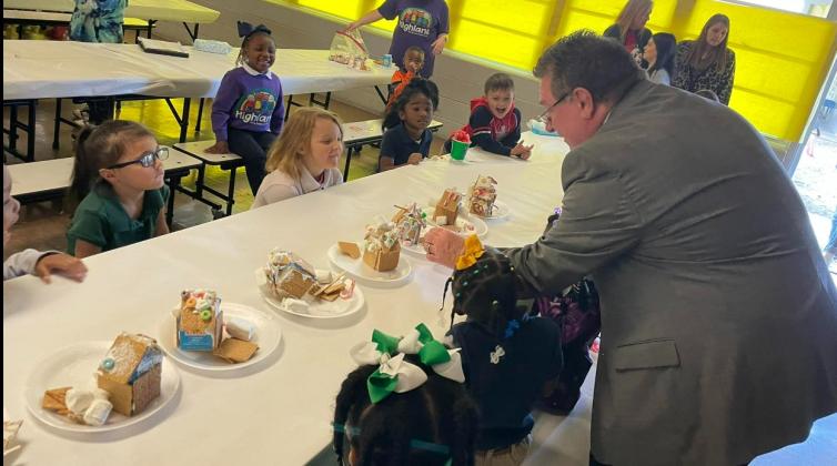 Eddie Thibodeaux looks over gingerbread houses at Highland