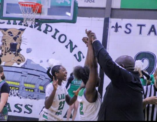 The Eunice Lady Cats celebrate a hard earned 39-35 win over Mamou last Friday evening. (Photo by Sports Editor Rhett Manuel)