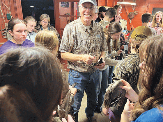 Mark Shirley, a coastal specialist with the LSU AgCenter and Louisiana Sea Grant, smiles while showing wings of various duck species to 4-H members participating in an Advanced Marsh Maneuvers camp in December. Photo by Hilton Waits/LSU AgCenter
