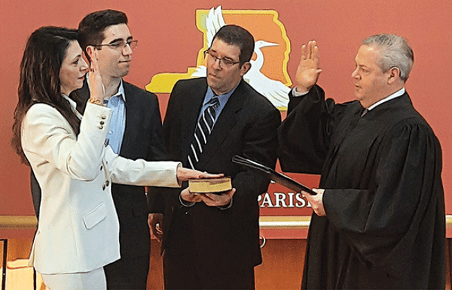 Sherri Zeringue McGovern, left, the incumbent St. Landry Parish assessor, has officially secured a second term in office following an unopposed re-election bid. McGovern has served since 2021. District Judge Jason Meche, right, administered the oath. She was joined by her son Christian and husband Steven. (Submitted photo)