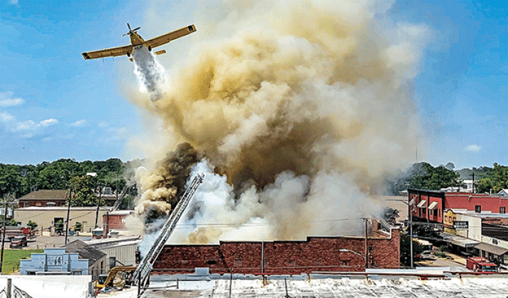 A crop duster flown by Robert Lejeune of Basile drops water on Nick’s on 2nd at about 1:30 p.m. Saturday, May 25. Eunice firefighters were dispatched to the fire at 11:53 a.m. Saturday. According to Fire Chief Chaise Brown on Tuesday a cause for the fire had not been established. There were no injuries reported from the fire. Eunice photographer Dwight Jodon captured his stunning image using a video mode on his camera then pulling the still image from it.