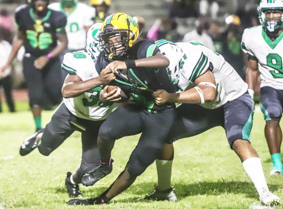 Eunice defense surrounds Washington Marion ball carrier