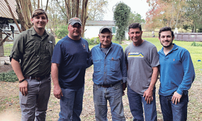Opelousas farmer Floyd Dupre, center, stands with his son and partner Mike Dupre, second to left, and Joey Dupre, far right, his grandson at LSU. Also pictured are Joey’s father, Joseph Floyd Dupre, second from right, and another of Floyd’s grandsons, Dustin LaFleur, far left.(Photo courtesy of the Dupres)