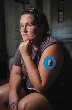 Courtney Massery sits for a portrait in her home in Ward, Arkansas. (Photo by Rory Doyle/Mississippi Center for Investigative Reporting)