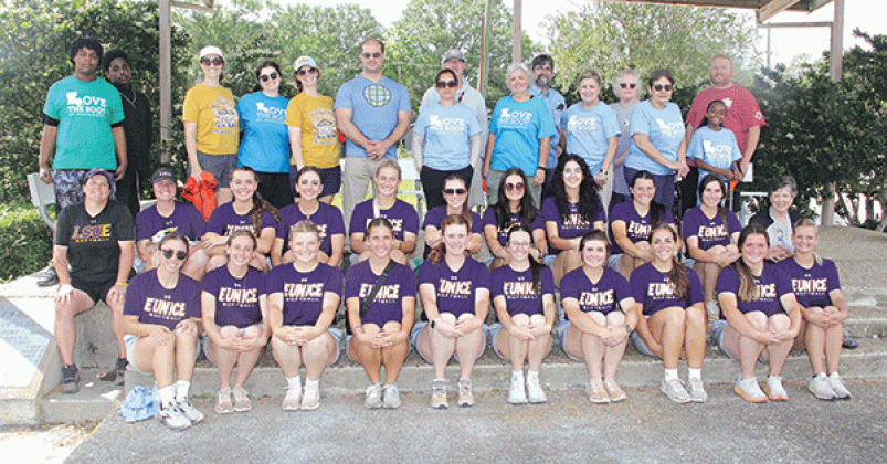 Some of the 248 volunteers who spread across Eunice on Saturday gathered for a photo in front of the Eunice Municipal Complex. The cleanup was part of Love the Boot in Louisiana. The local cleanup was organized by Keep Eunice Beautiful. The crew in front are members of the LSUE softball team. (Photo by Harlan Kirgan)
