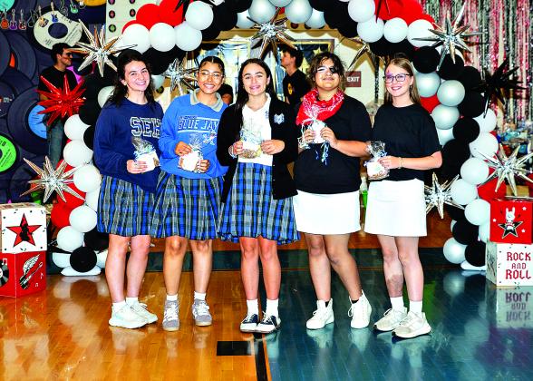 Young Christian Girls at St. Edmund High were honored. From left are Ninth grader Tiana Orlando, Tenth grader  Isabella Arnaud, Eleventh grader Journey Semien, and Twelfth grader Katy Miller and Caroline Fontenot.