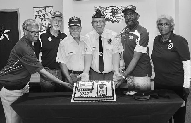 St. Landry Parish Veterans Purple Heart Day group photo with cake