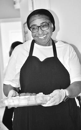 Woman smiling and holding tray