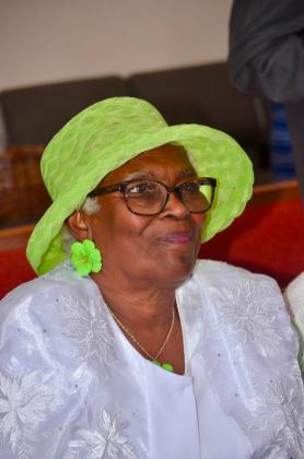 Smiling woman in green hat
