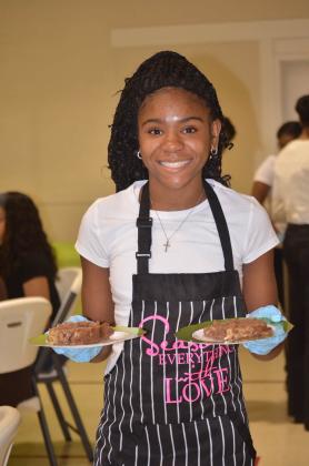 Woman smiling and holding treats