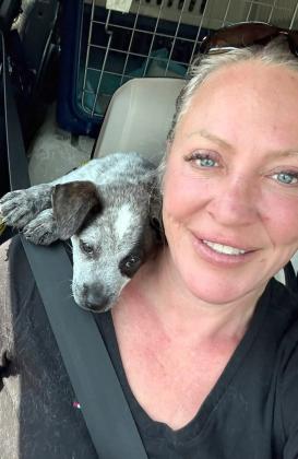 Puppy on womans shoulder