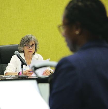 St. Landry Parish School Board member Mary Ellen Donatto listens to the budget presentation by Shaun Grantham, chief financial officer, at a Committee of the Whole meeting on Monday. (Photo by Harlan Kirgan)
