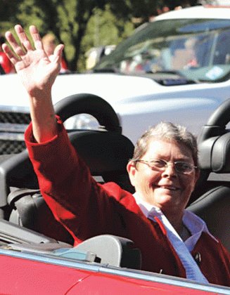 Berline Boone waves to the crowd during the 2014 La. Swine Festival Parade.