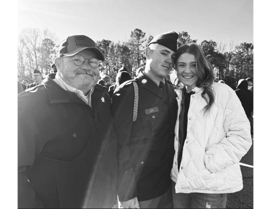 Cain with his grown children, William, following in his father’s footsteps and his daughter, Carli, who followed in her mother’s footsteps becoming a nurse.