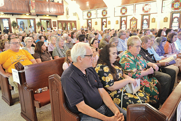 By the time the rosary began prior to the 64th anniversary Mass for Charlene Richard, “The Little Cajun Saint,” every seat in St. Edward Catholic Church in Richard was filled. The annual Mass was celebrated Aug. 11 the anniversary of Richard’s death. (Photo by Claudette Olivier/ Crowley Post-Signal)