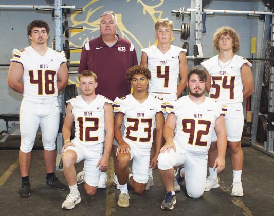 Iota top returning defensive starters kneeling from left, are Christian Beasley, Bryson Allison and Brock Keltner. Standing, from left, are Trevor Ruffner, coach Ray Aucoin, Blayton Fontenot and Scott Jackson. (Photo by Charles Sexton)
